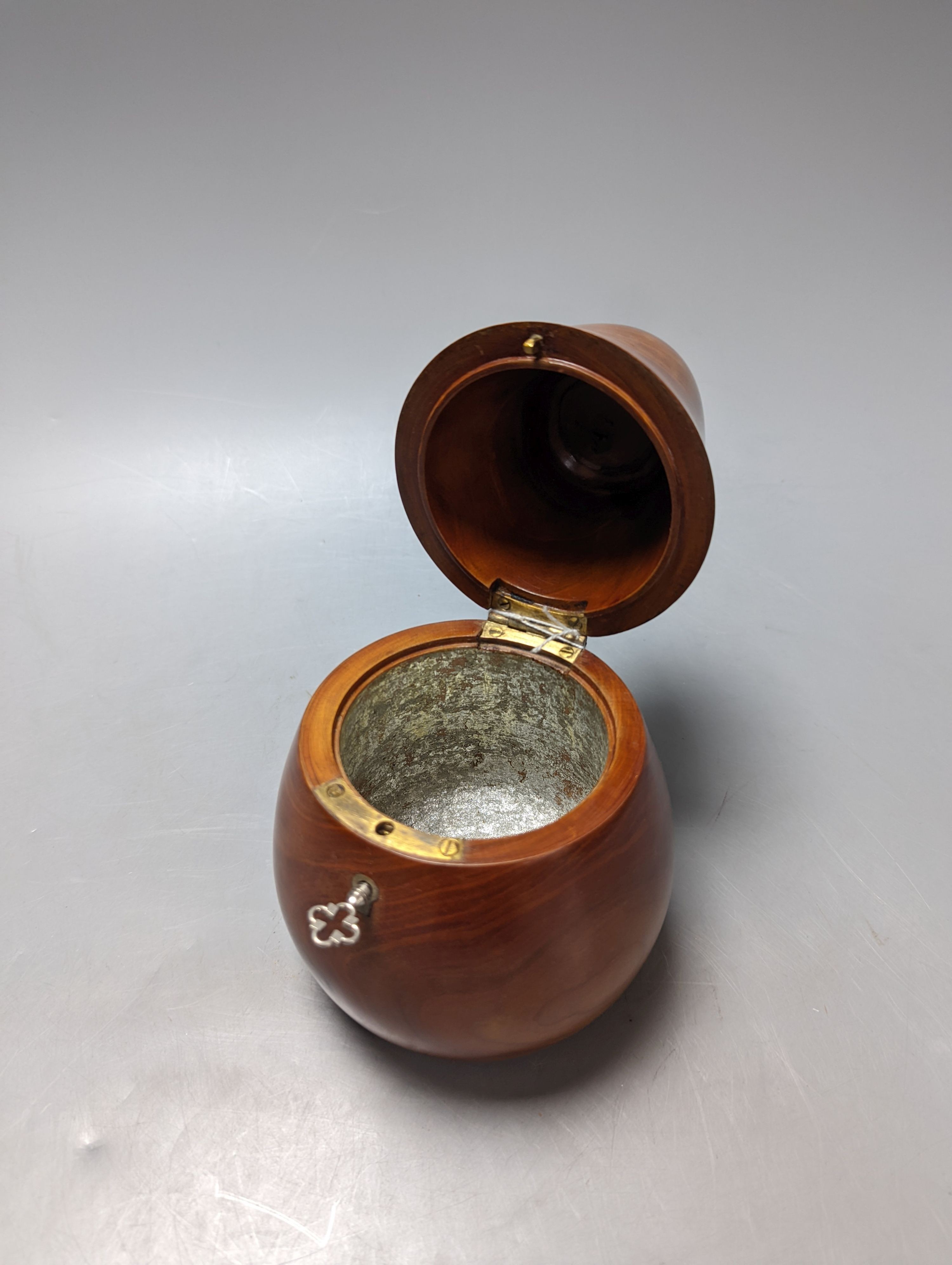 A George III style fruitwood pear shaped tea caddy, 21 cms high.